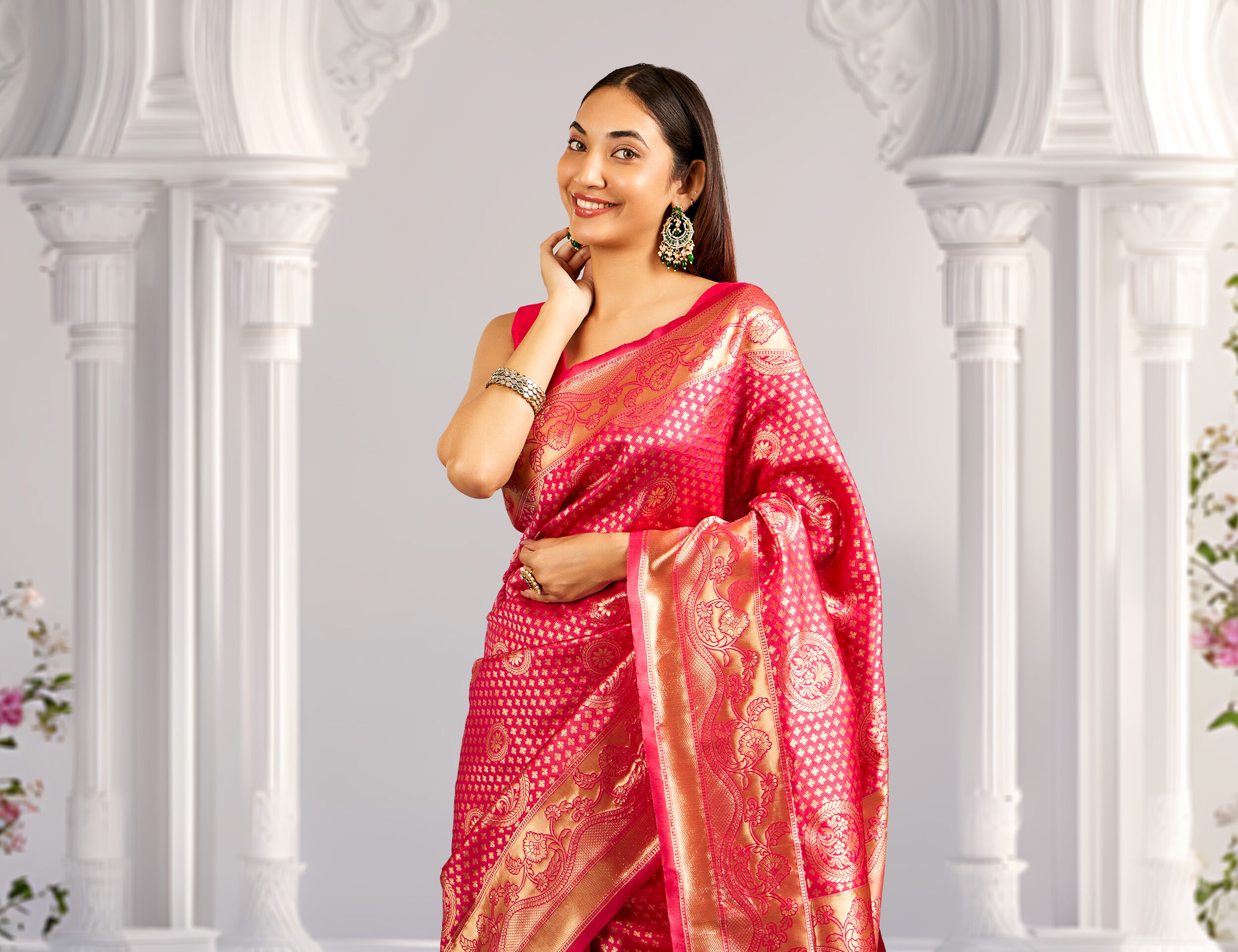 A woman wearing a red silk saree